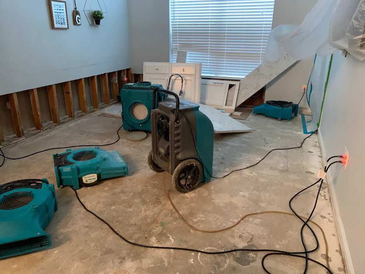 Dehumidifier in flood-cut room for Water Damage Restoration in Castle Pines Village